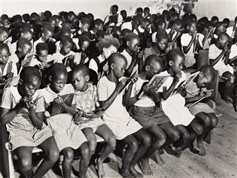 MARGARET BOURKE-WHITE (1904-1971) Children, South Africa * Women of Serowe, Bechuanaland, clicking tongue in greeting, leading parade p